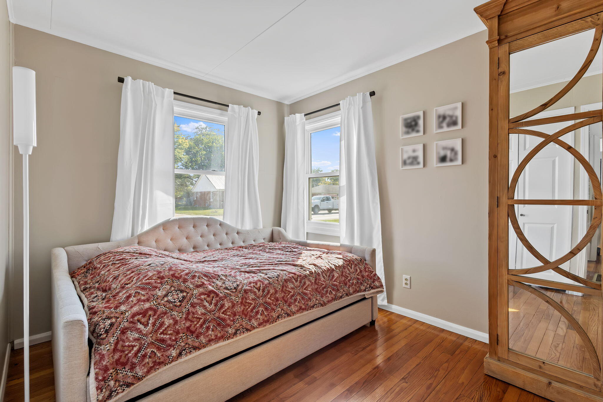 810 East Grace Street Rensselaer, IN 47978 - Photo 8 of 17 a bedroom with a bed window and a flat screen tv