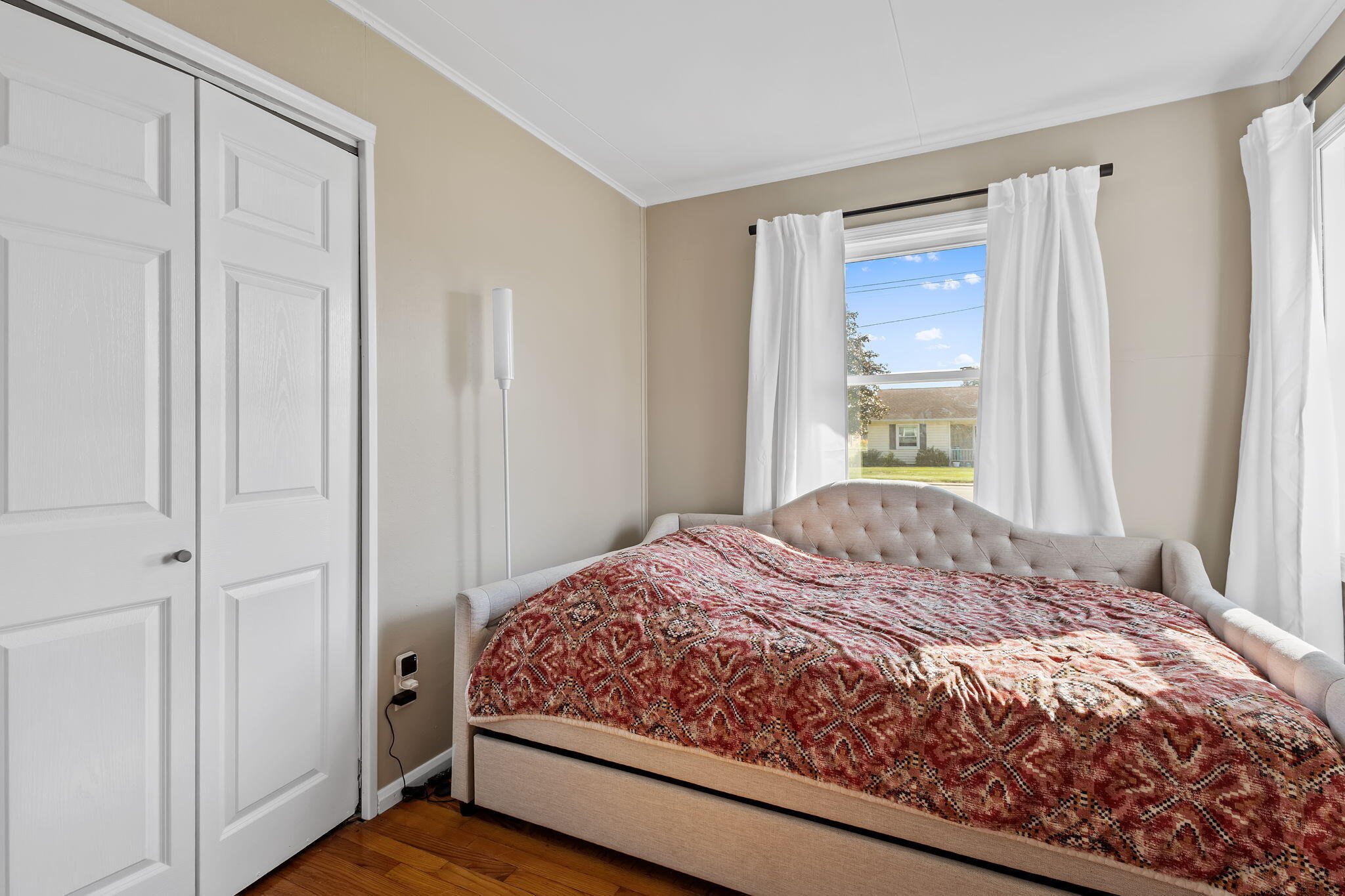 810 East Grace Street Rensselaer, IN 47978 - Photo 9 of 17 a bedroom with a bed and a window