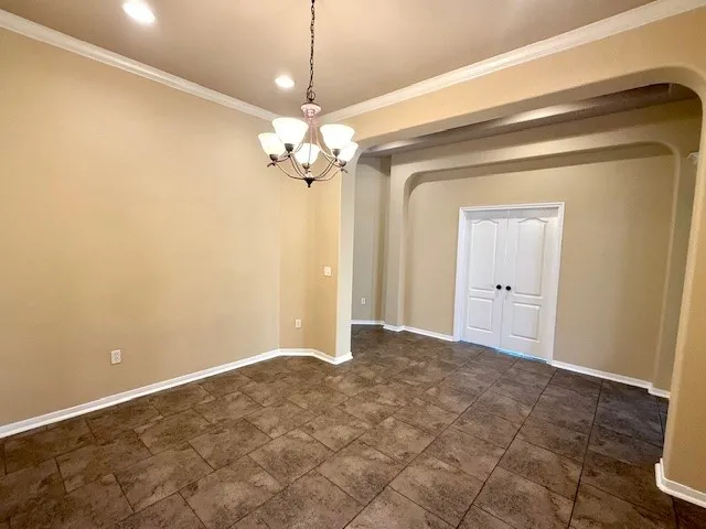 a view of kitchen with refrigerator and microwave
