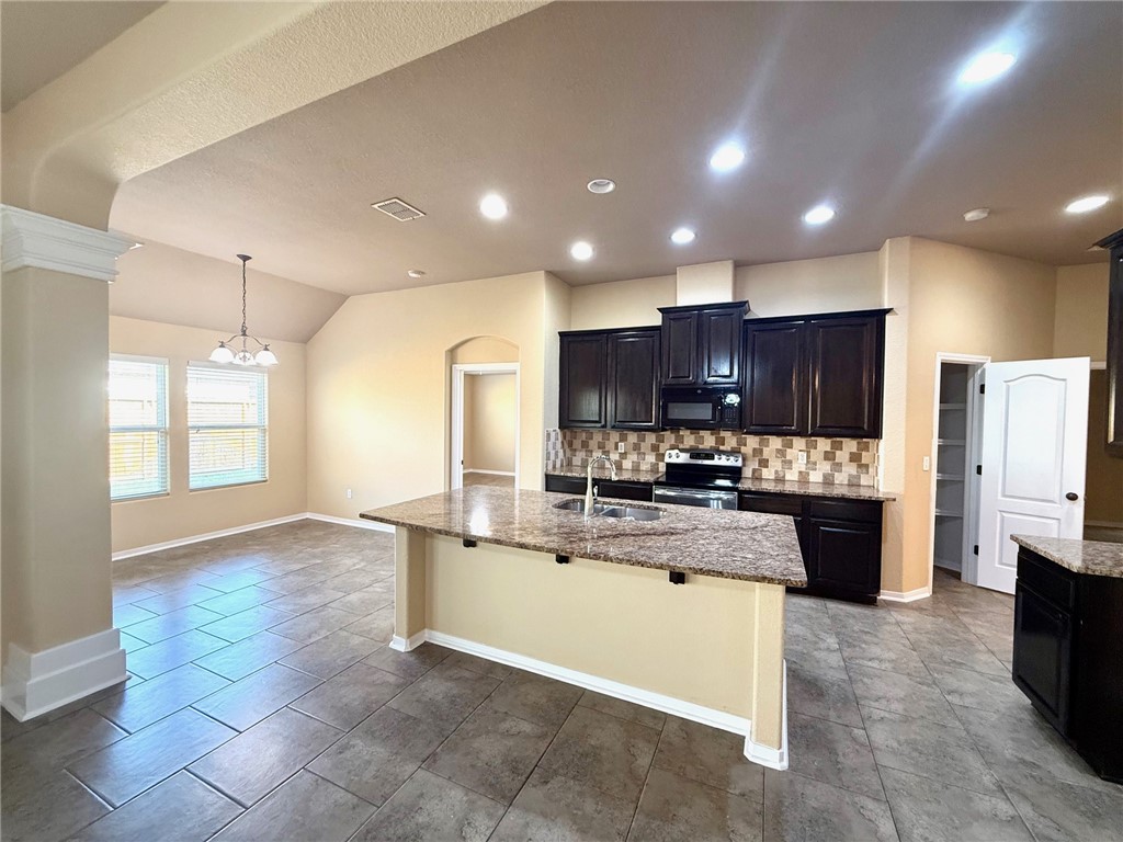 2205 Cardinales Lane Corpus Christi, TX 78414 - Photo 17 of 34 a large kitchen with stainless steel appliances lots of counter space and breakfast area