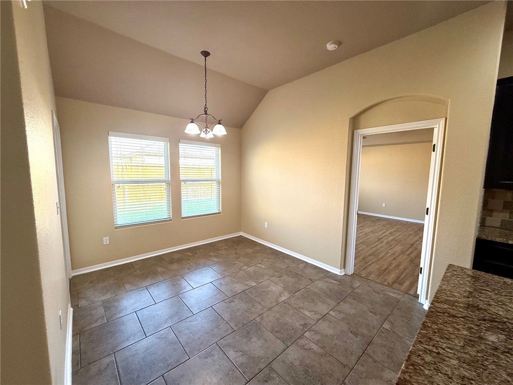 2205 Cardinales Lane Corpus Christi, TX 78414 - Photo 18 of 34 a view of an empty room with window and chandelier fan