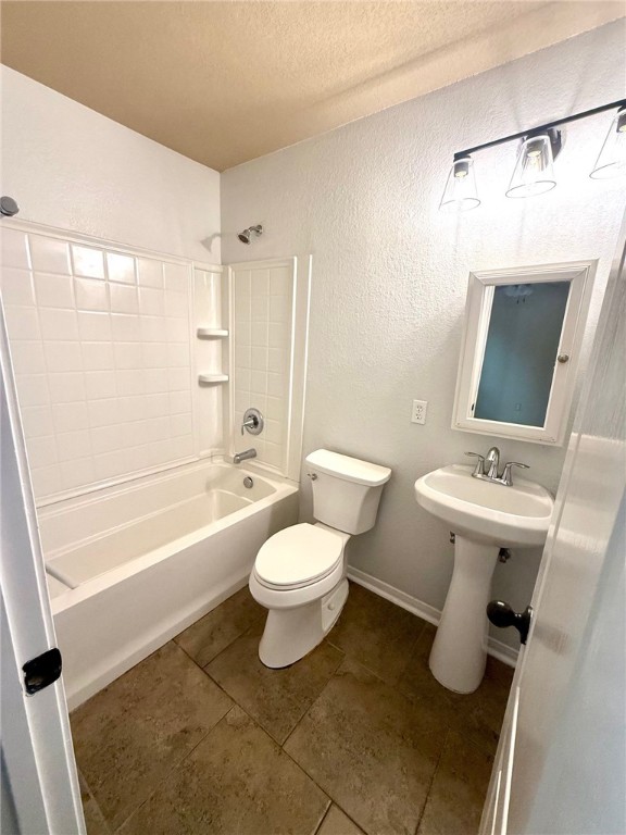 2205 Cardinales Lane Corpus Christi, TX 78414 - Photo 27 of 34 a bathroom with a sink toilet and shower
