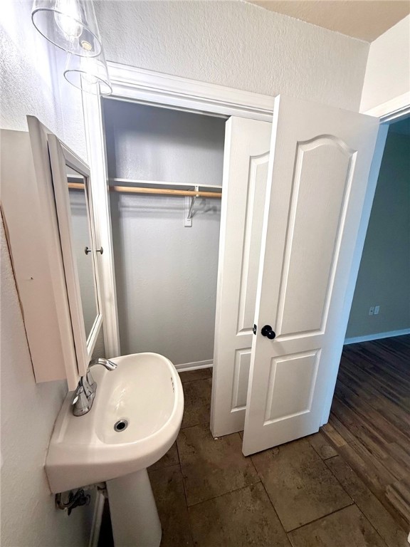2205 Cardinales Lane Corpus Christi, TX 78414 - Photo 28 of 34 a bathroom with a sink a toilet a mirror and shower