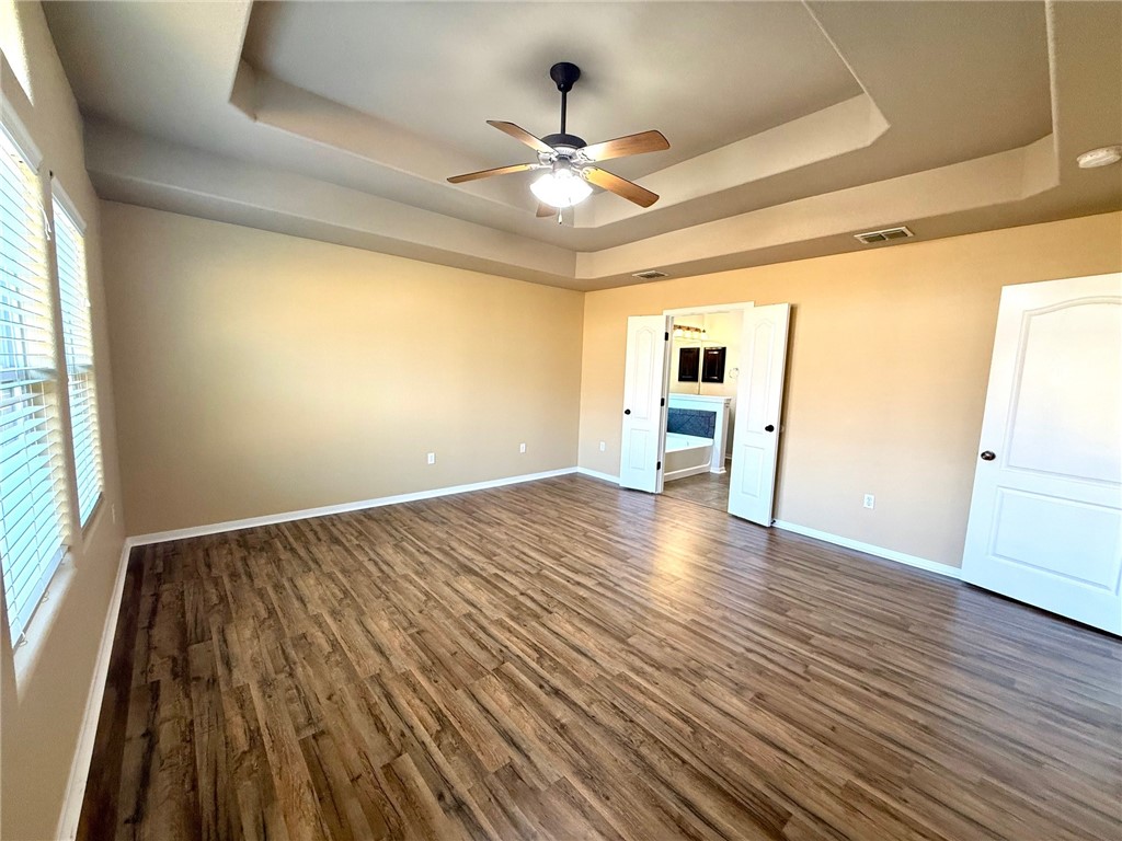 2205 Cardinales Lane Corpus Christi, TX 78414 - Photo 30 of 34 wooden floor in an empty room with a window