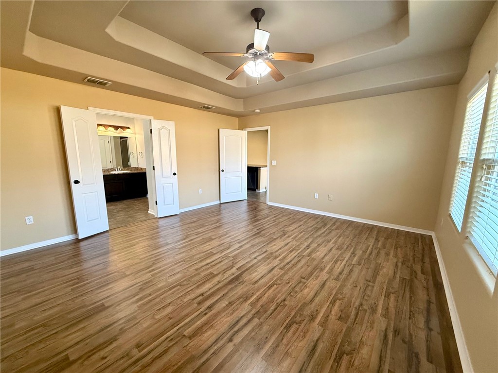 2205 Cardinales Lane Corpus Christi, TX 78414 - Photo 31 of 34 wooden floor in an empty room with a window