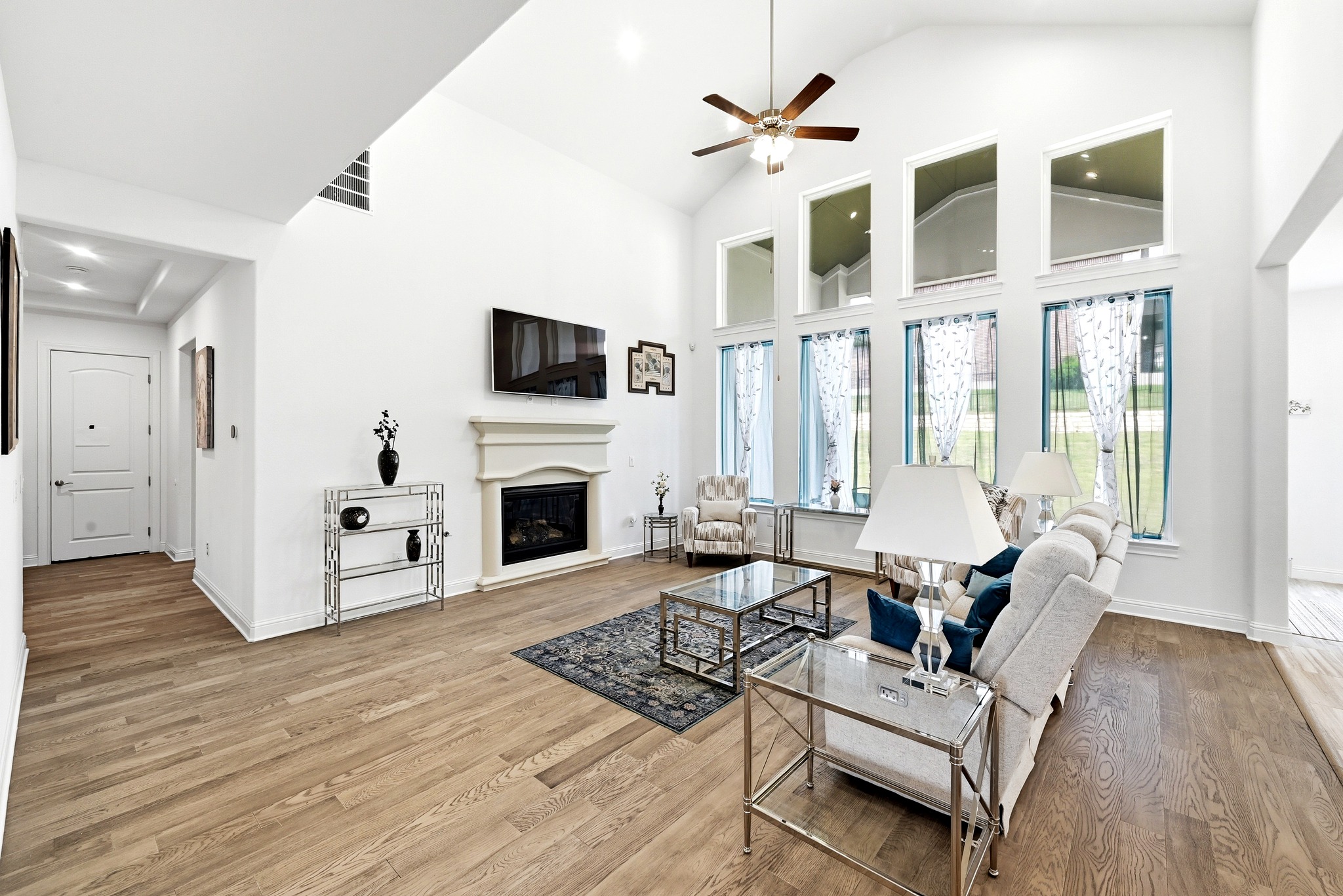 4601 Apollonia Way Leander, TX 78641 - Photo 10 of 40 a living room with furniture a fireplace and a flat screen tv