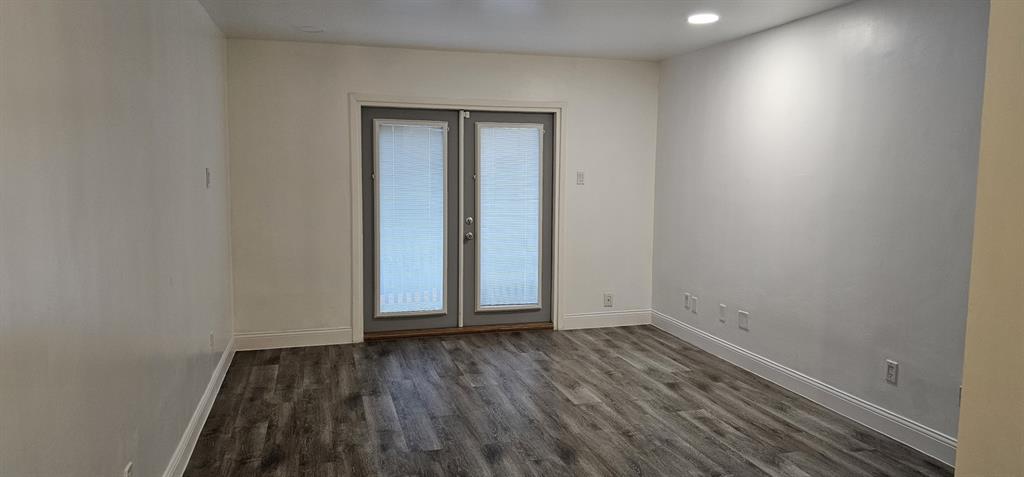 4845 Cedar Springs Road, Unit 167 Dallas, TX 75219 - Photo 2 of 10 a view of an empty room and wooden floor