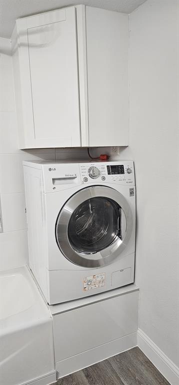 4845 Cedar Springs Road, Unit 167 Dallas, TX 75219 - Photo 5 of 10 a utility room with dryer and washer