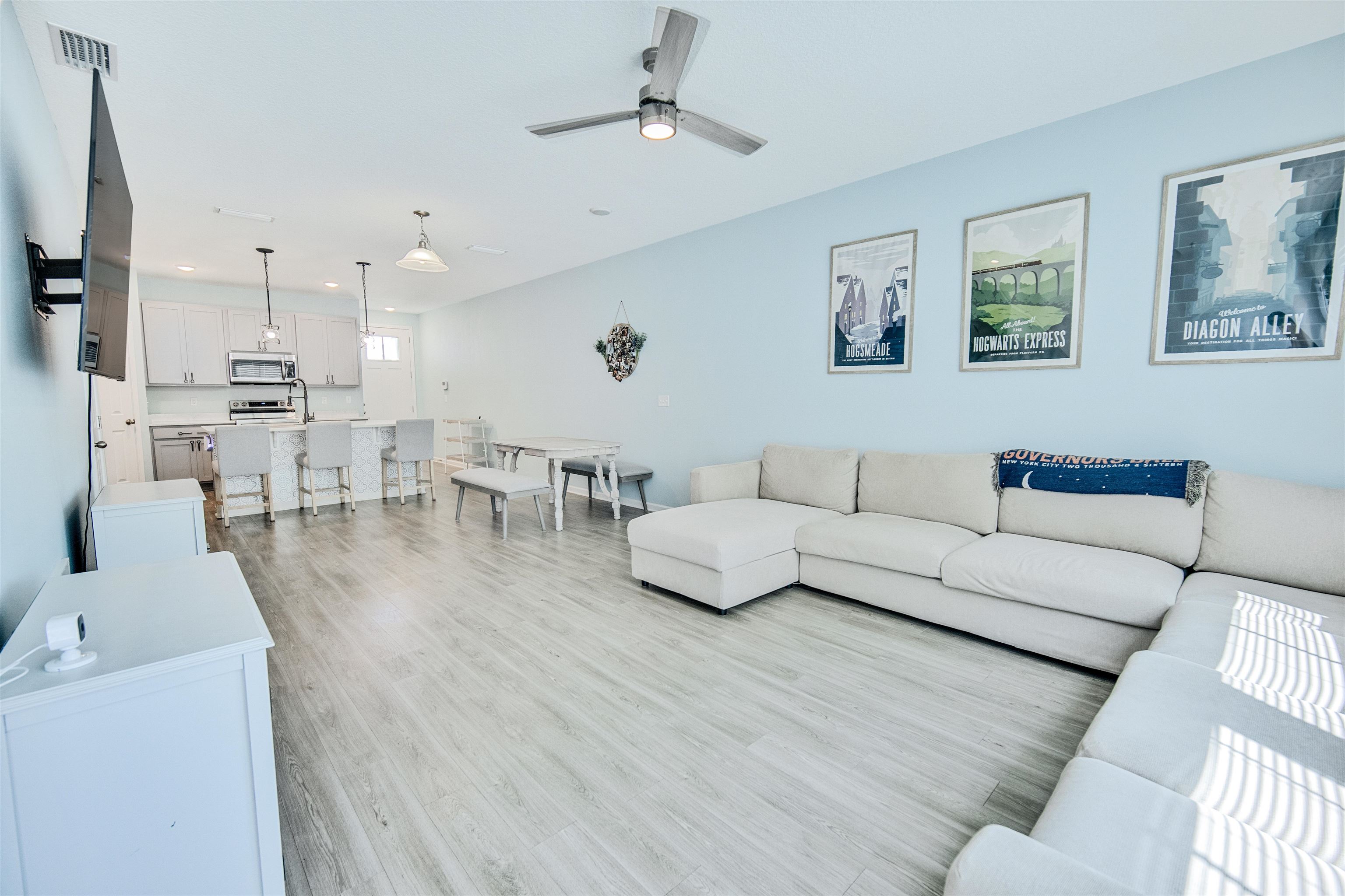 98 Ridge Lake Road St. Augustine, FL 32086 - Photo 12 of 31 a living room with furniture kitchen view and a wooden floor