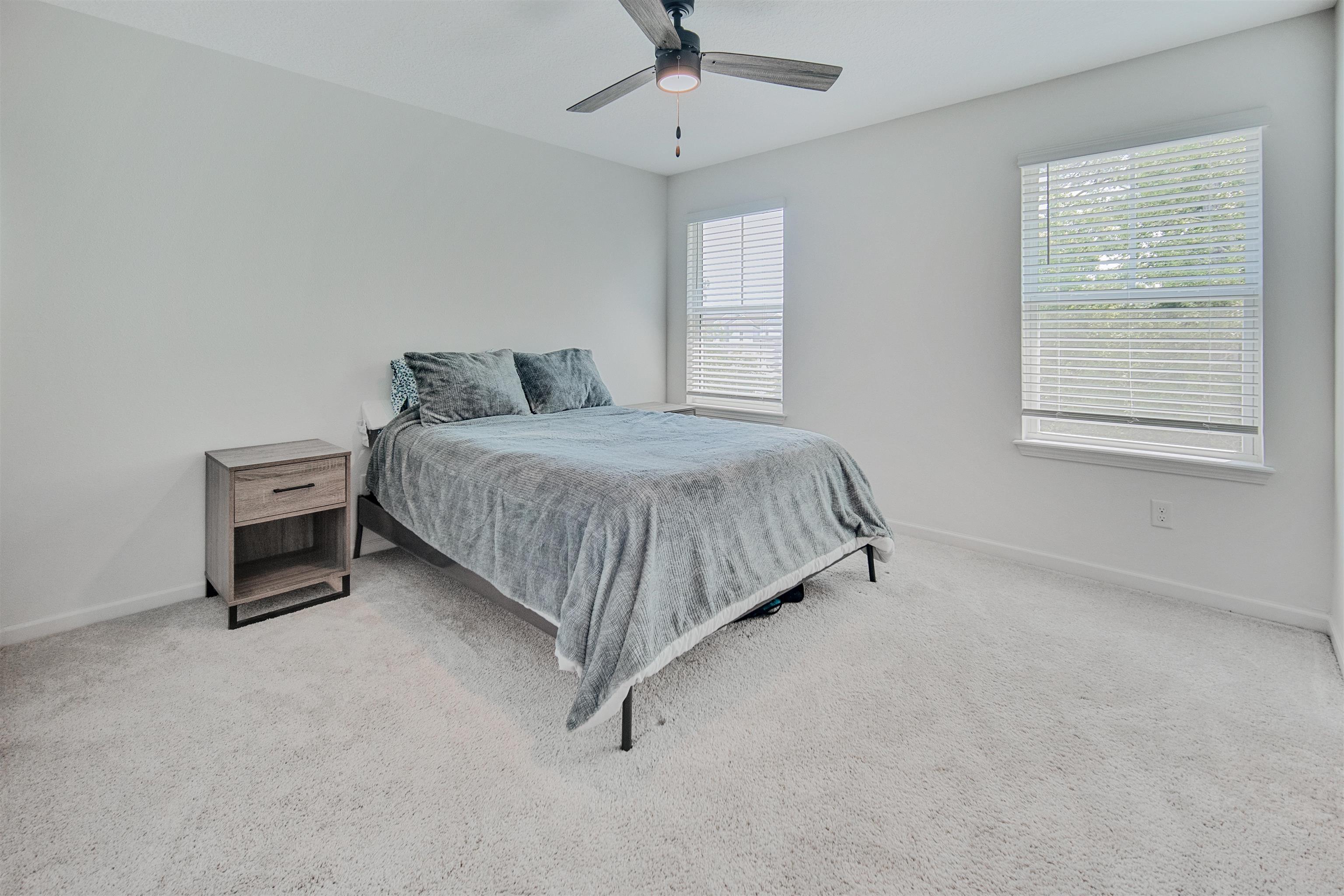 98 Ridge Lake Road St. Augustine, FL 32086 - Photo 13 of 31 a bedroom with a bed and a window