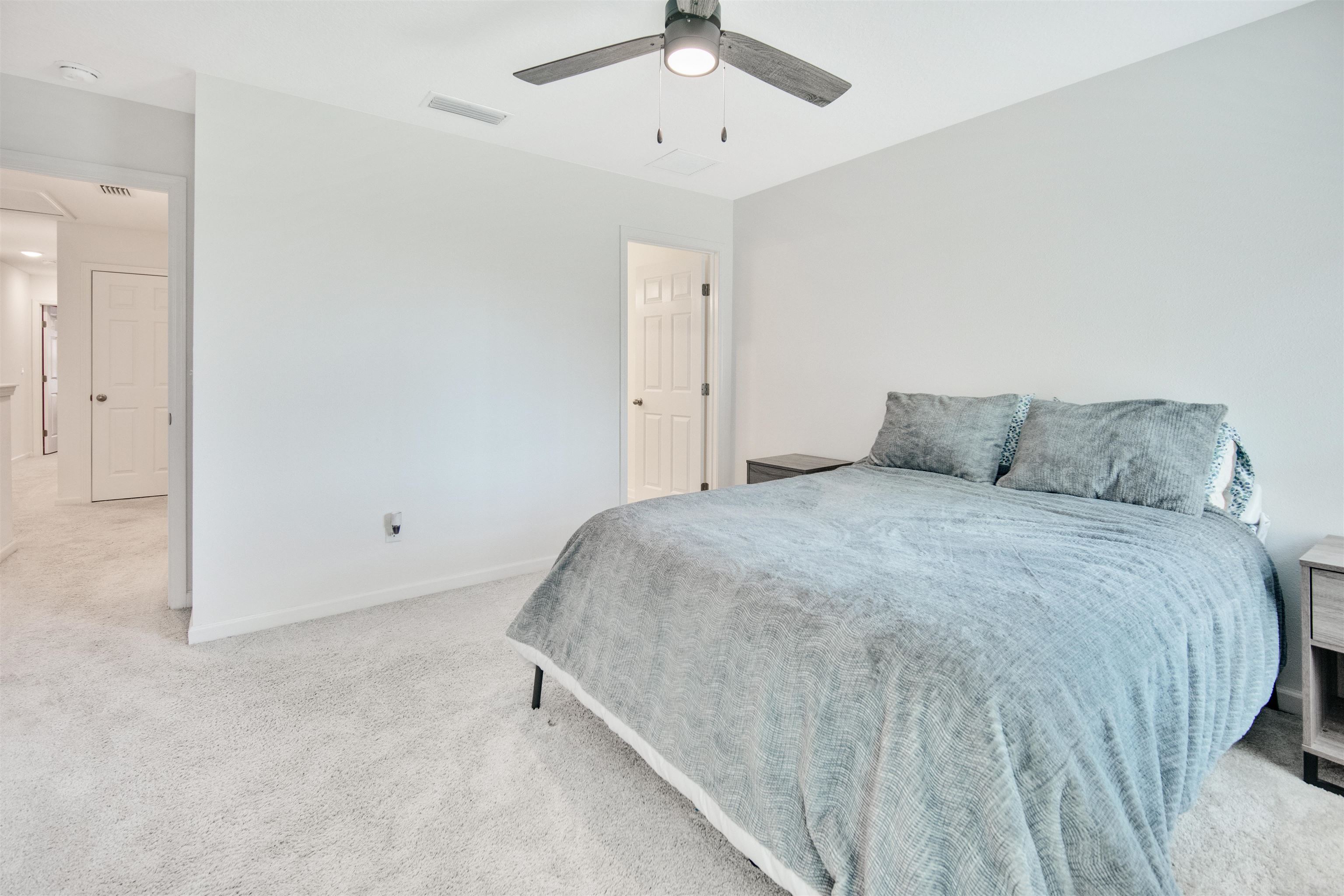 98 Ridge Lake Road St. Augustine, FL 32086 - Photo 14 of 31 a bedroom with a bed and a ceiling fan