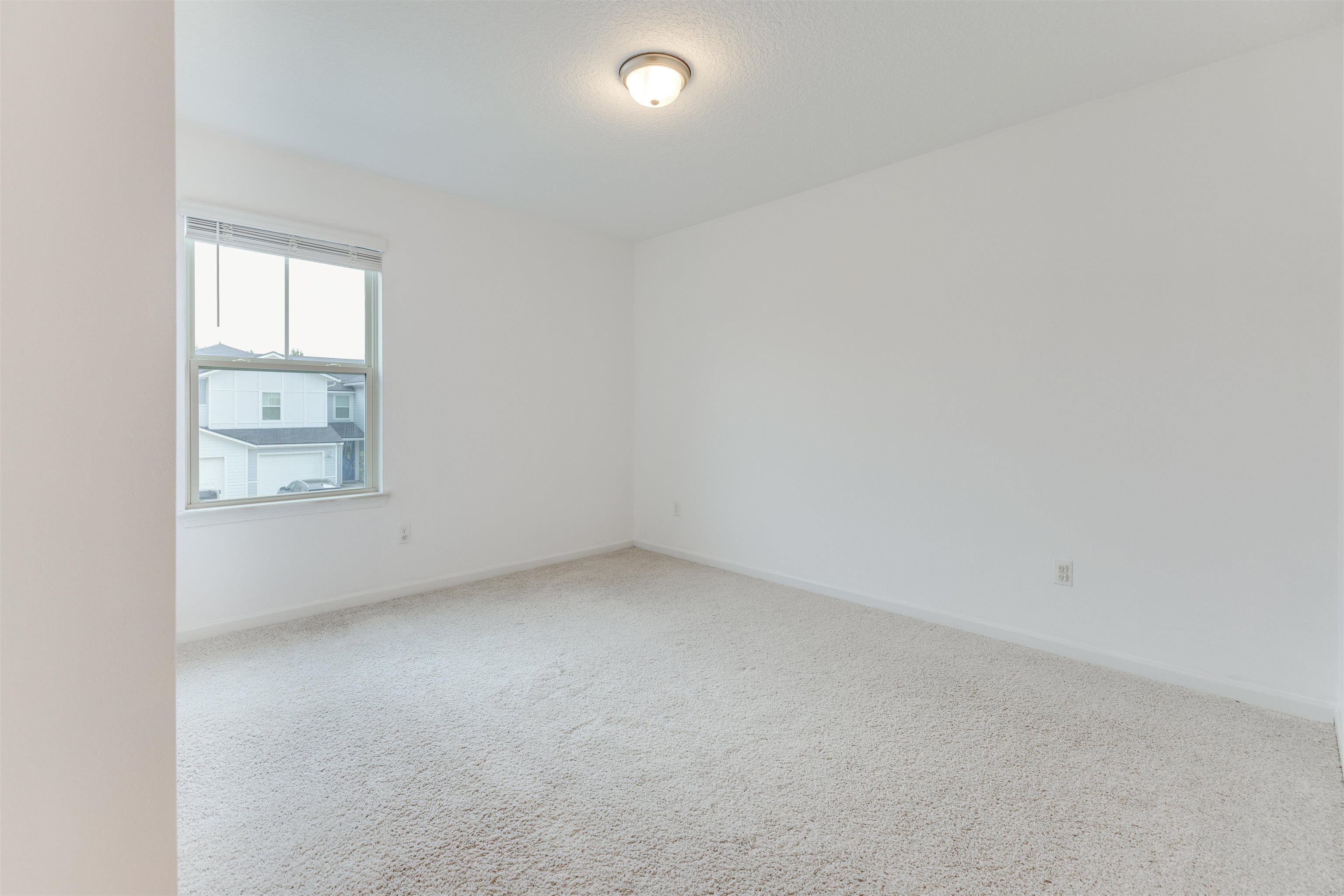 98 Ridge Lake Road St. Augustine, FL 32086 - Photo 22 of 31 an empty room with a window