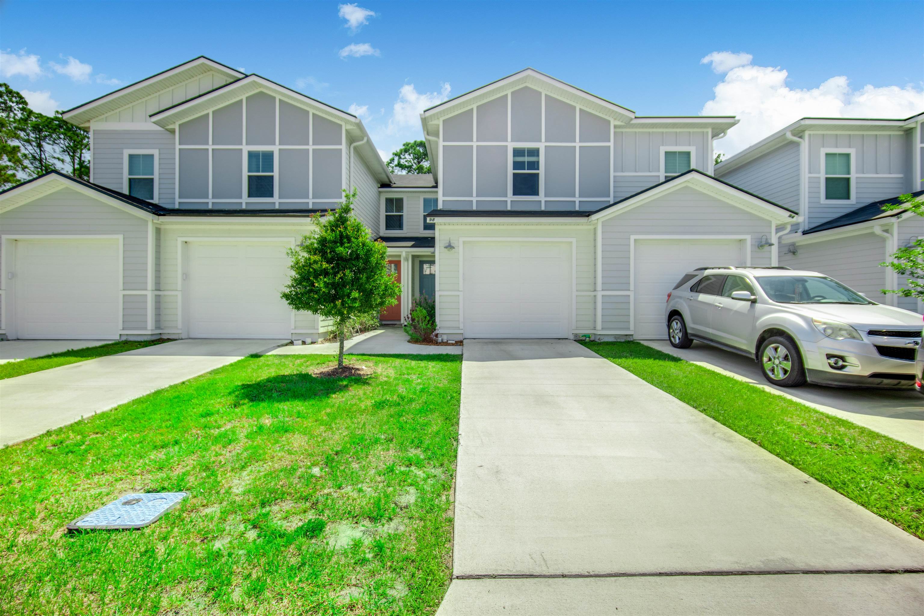98 Ridge Lake Road St. Augustine, FL 32086 - Photo 3 of 31 a front view of a house with a yard and garage