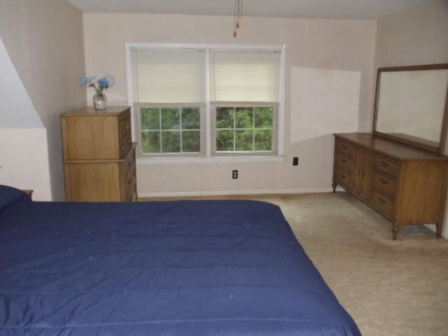 1998 Hidden Hills Road Pulaski, TN 38478 - Photo 13 of 20 a view of empty room with wooden floor and fan