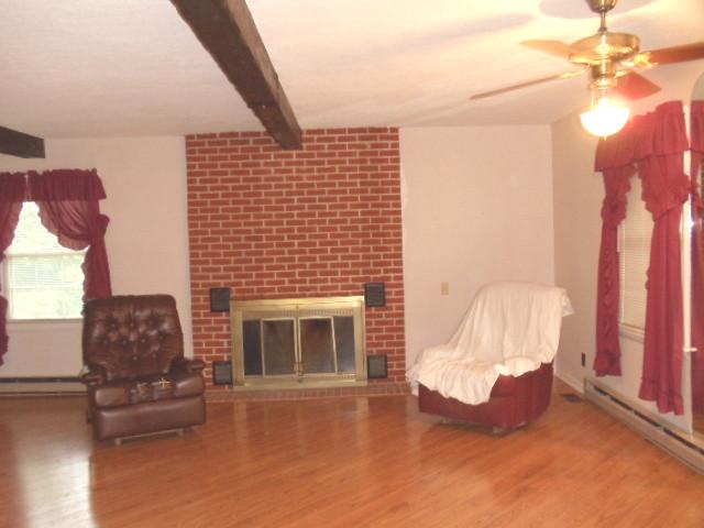 1998 Hidden Hills Road Pulaski, TN 38478 - Photo 20 of 20 a living room with furniture and a fireplace