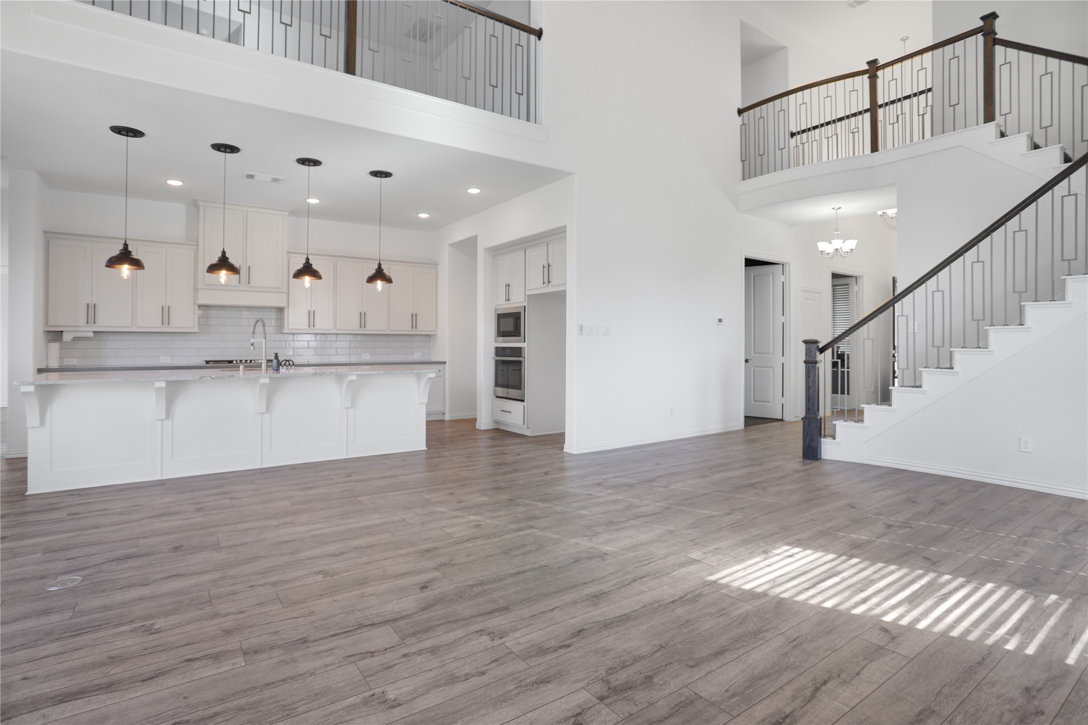 2718 Ripe Amber Cup Court Richmond, TX 77406 - Photo 6 of 43 a view of kitchen with wooden floor and electronic appliances