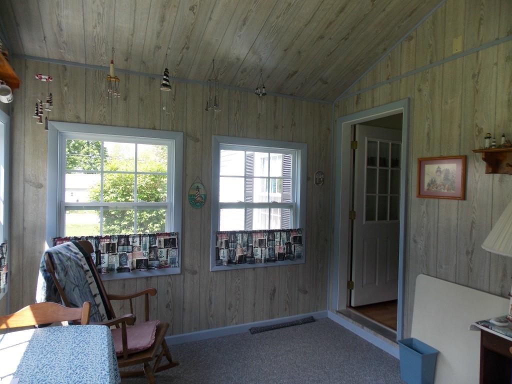 179 Industry Road New Sharon, ME 04955 - Photo 15 of 26 View of the sunroom. Door to the...