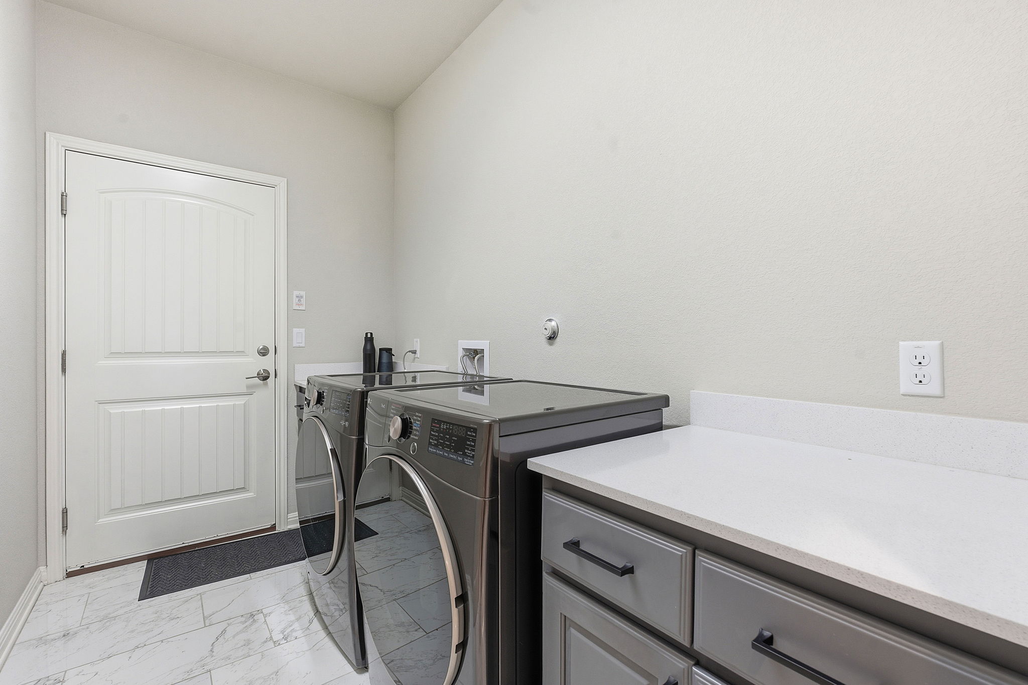 5720 Baythorne Drive Austin, TX 78747 - Photo 13 of 19 a utility room with dryer and washer