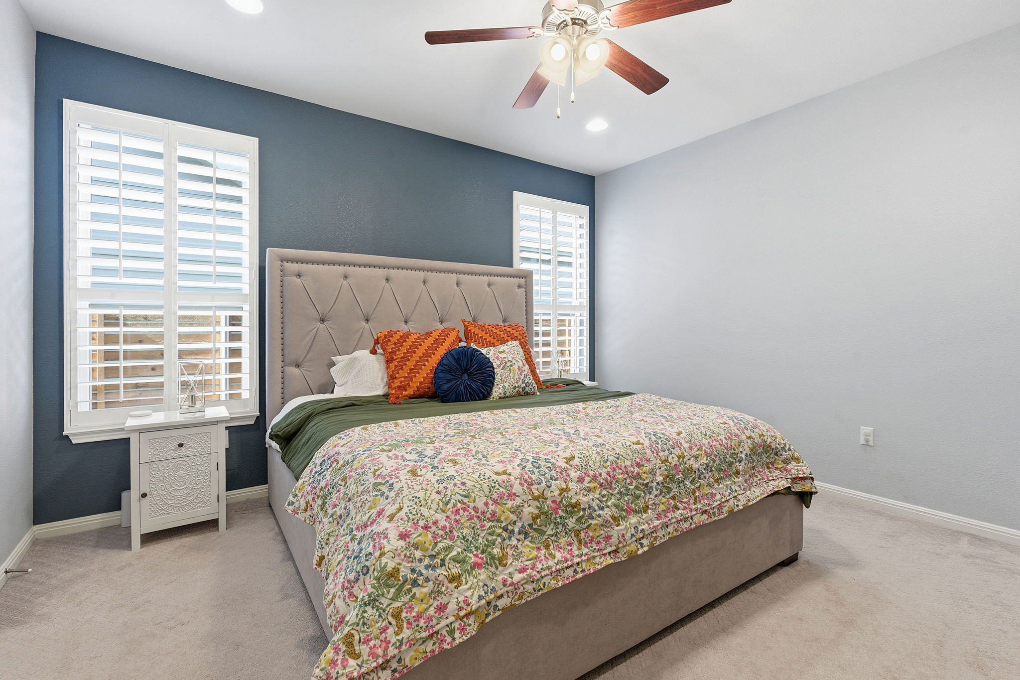 5720 Baythorne Drive Austin, TX 78747 - Photo 14 of 19 a bedroom with a bed and a chandelier