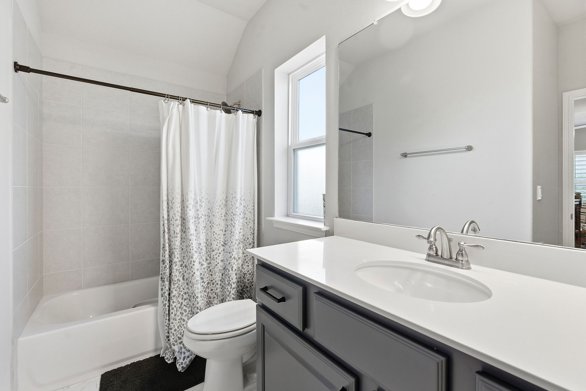 5720 Baythorne Drive Austin, TX 78747 - Photo 16 of 19 a bathroom with a sink and a mirror