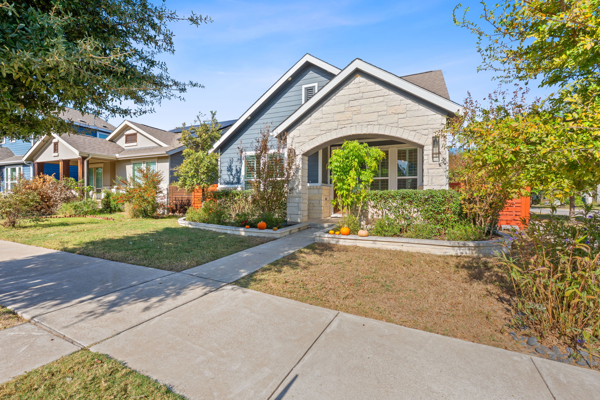 5720 Baythorne Drive Austin, TX 78747 - Photo 2 of 19 a front view of a house with a yard