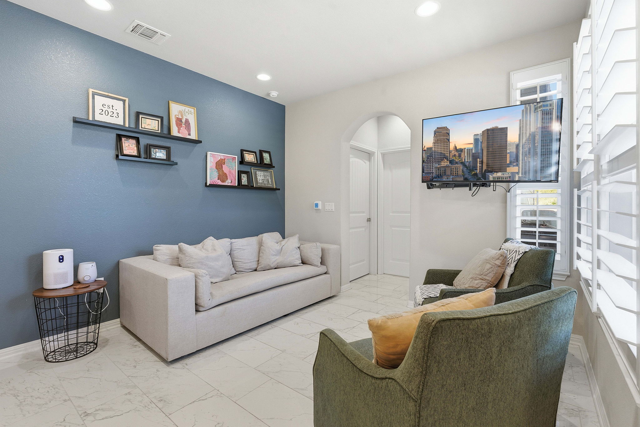 5720 Baythorne Drive Austin, TX 78747 - Photo 4 of 19 a living room with furniture and a flat screen tv
