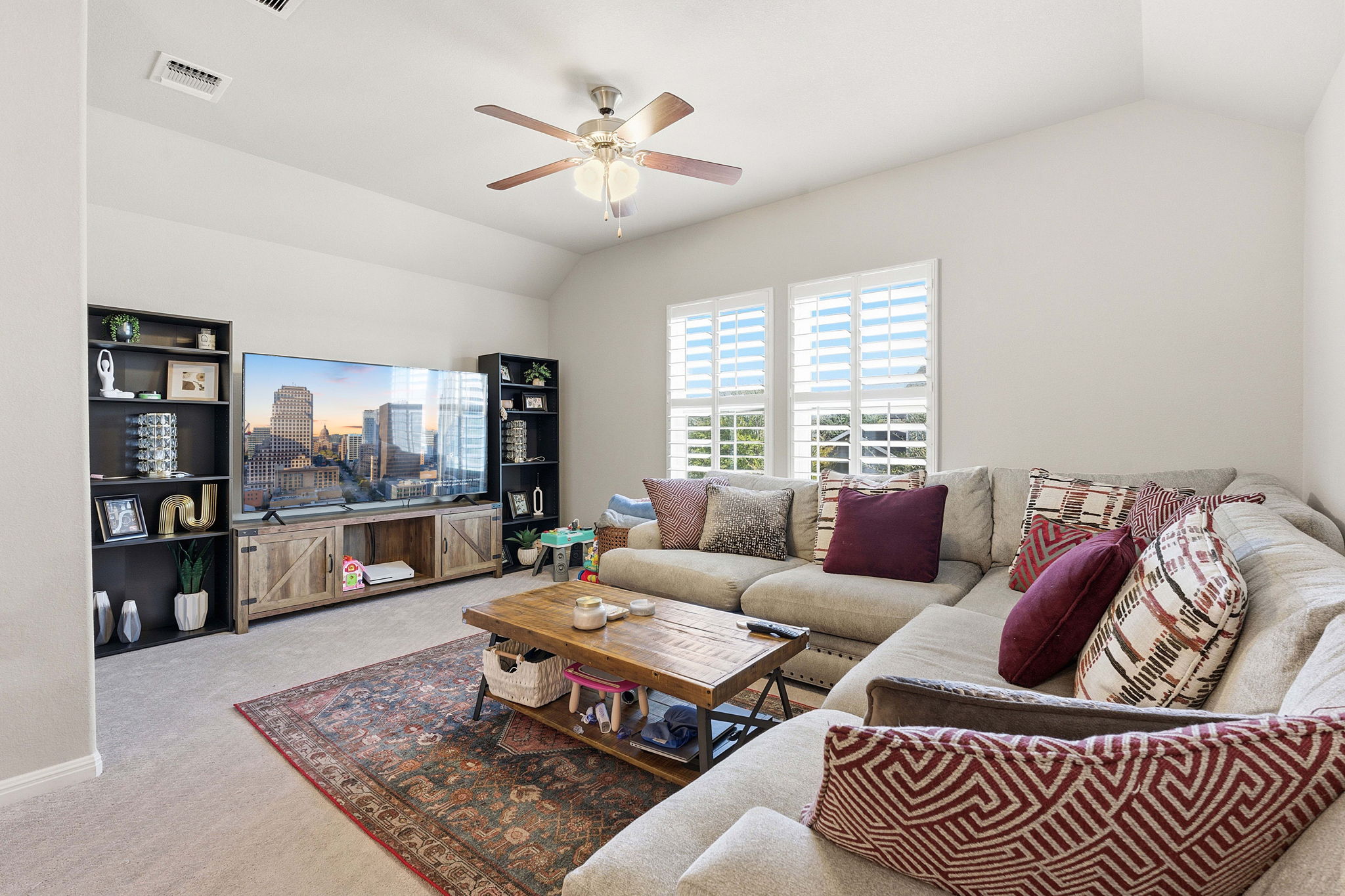 5720 Baythorne Drive Austin, TX 78747 - Photo 9 of 19 a living room with furniture and a rug