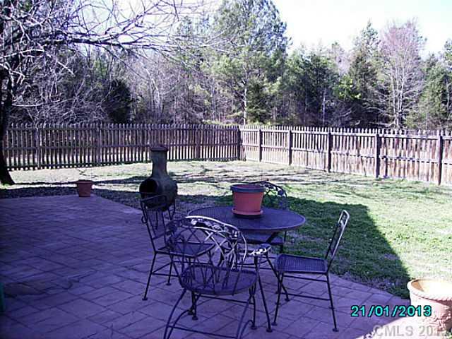 7680 Stokes Ferry Road Salisbury, NC 28146 - Photo 14 of 16 a view of a chairs and table on the wooden floor