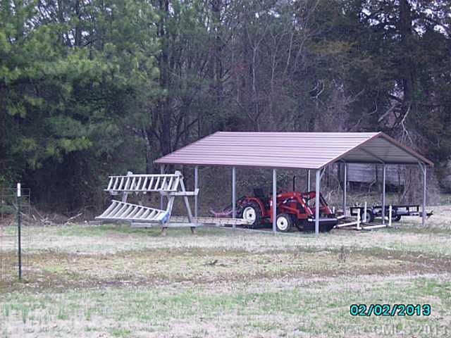 7680 Stokes Ferry Road Salisbury, NC 28146 - Photo 16 of 16 a front view of a house with garden
