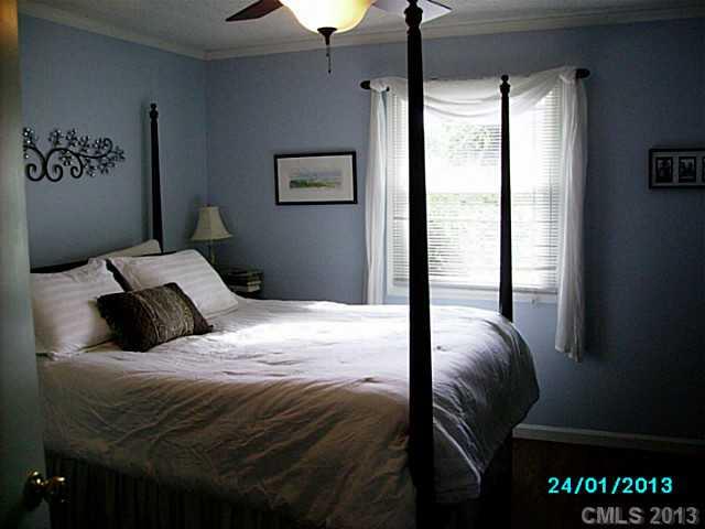 7680 Stokes Ferry Road Salisbury, NC 28146 - Photo 6 of 16 a bedroom with a bed and a window