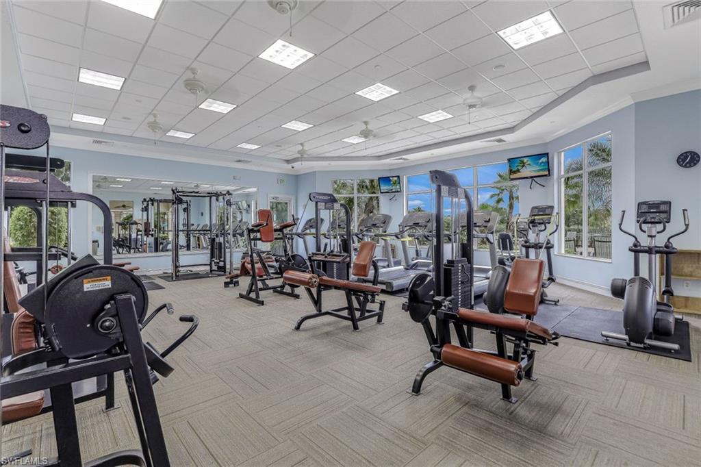 1614 Triangle Palm Terrace Naples, FL 34119 - Photo 31 of 40 a view of a room with gym equipment