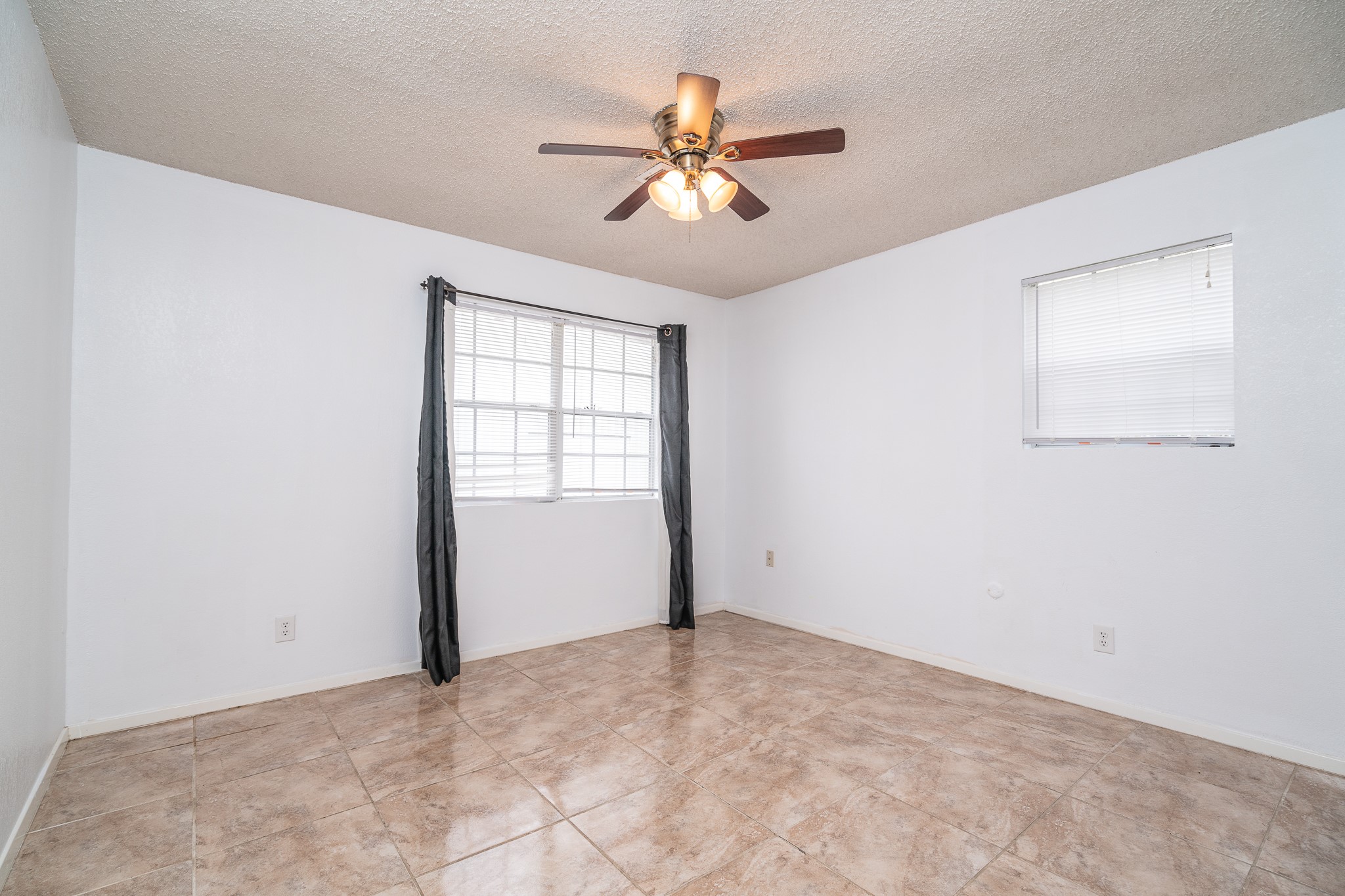 3409 Herbert Pearland, TX 77584 - Photo 11 of 17 an empty room with fan and windows