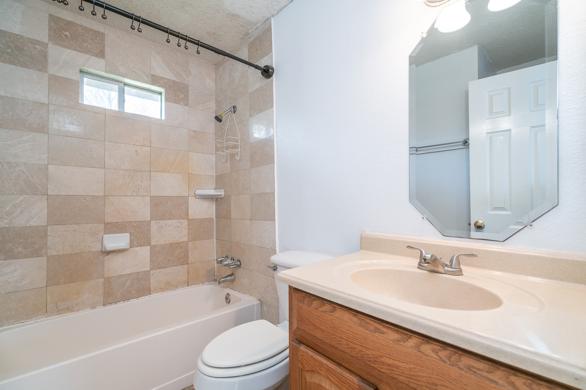 3409 Herbert Pearland, TX 77584 - Photo 13 of 17 a bathroom with a granite countertop sink toilet tub and shower