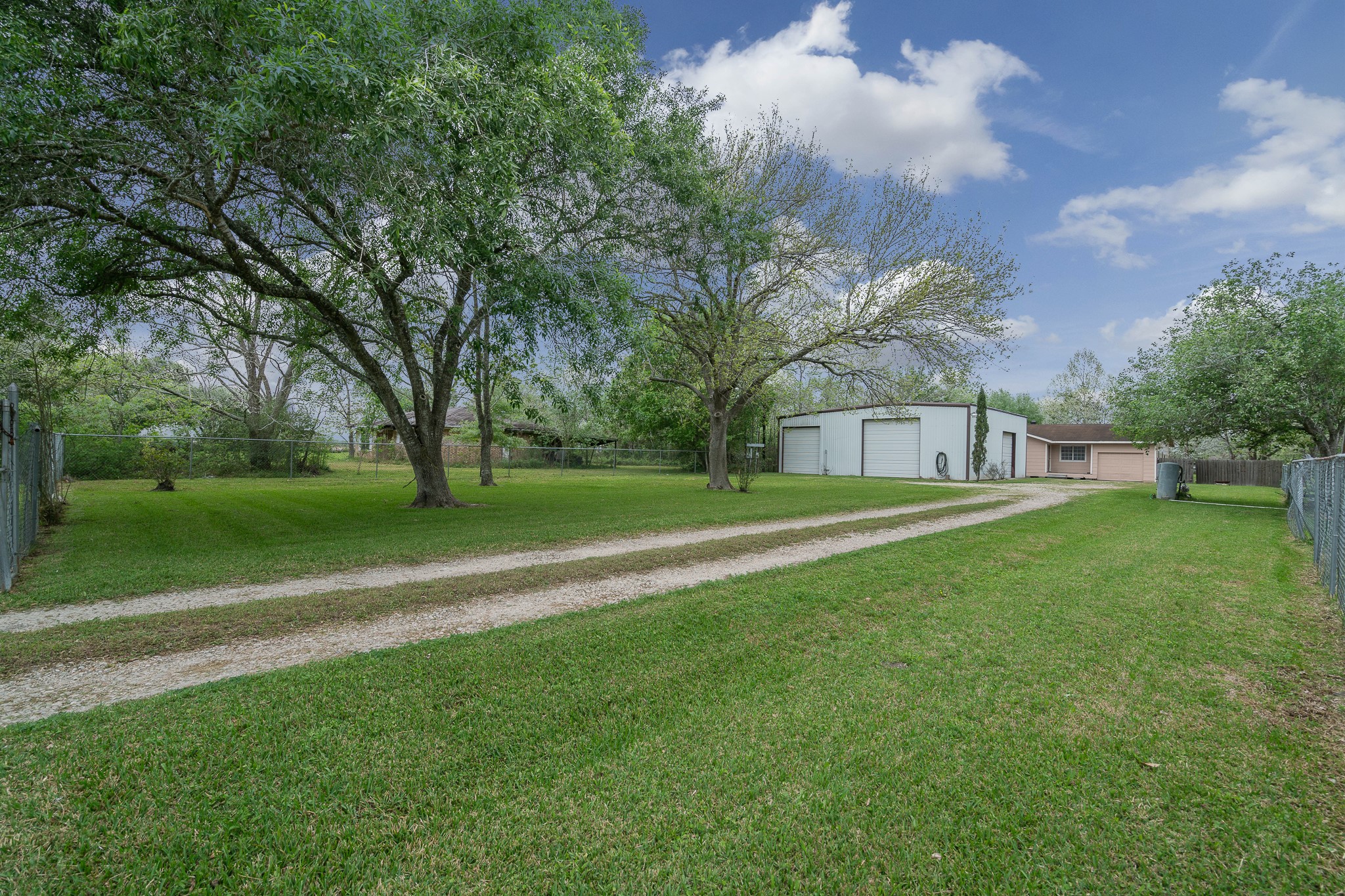 3409 Herbert Pearland, TX 77584 - Photo 2 of 17 a view of a park with large trees