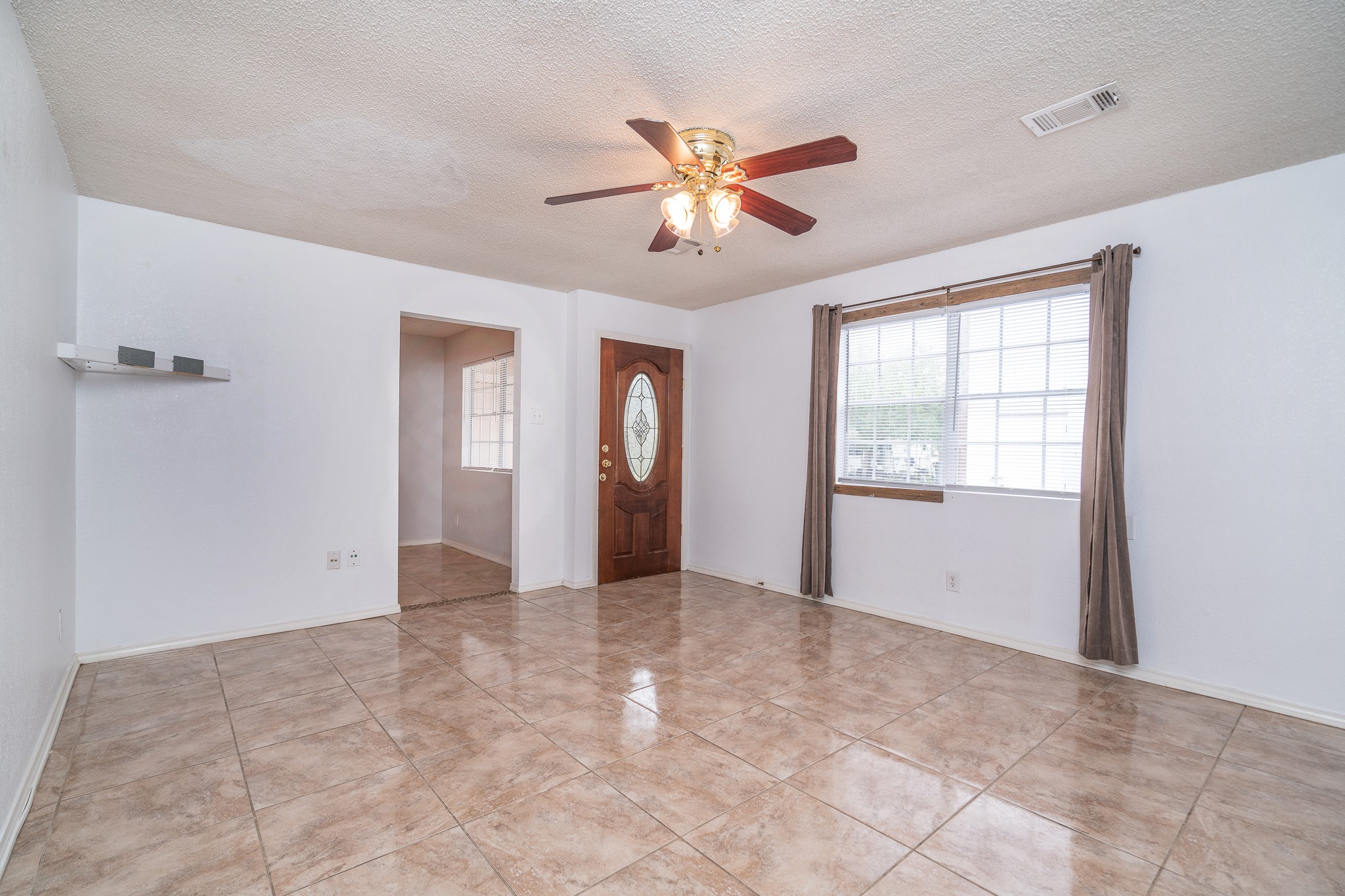 3409 Herbert Pearland, TX 77584 - Photo 3 of 17 a view of an empty room with a window