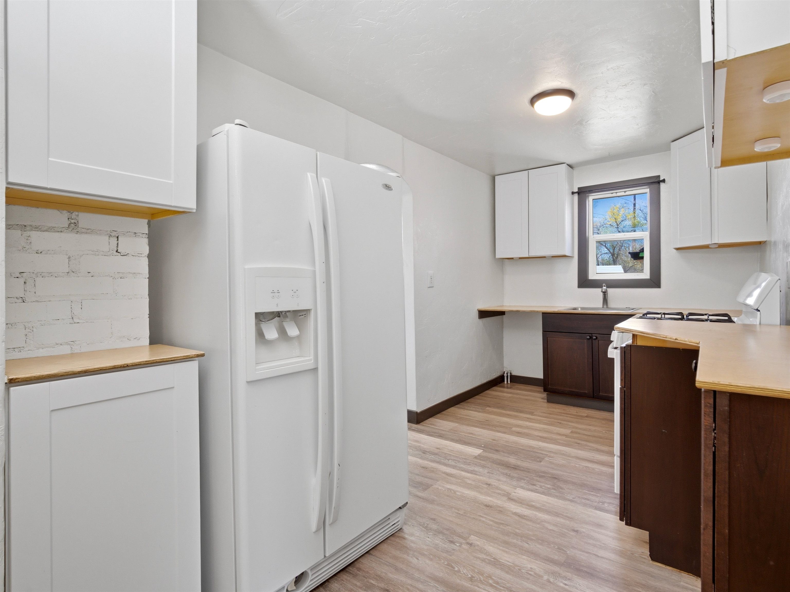 333 Highway 6 And 50 Fruita, CO 81521 - Photo 11 of 36 a kitchen with stainless steel appliances granite countertop a refrigerator and a stove top oven
