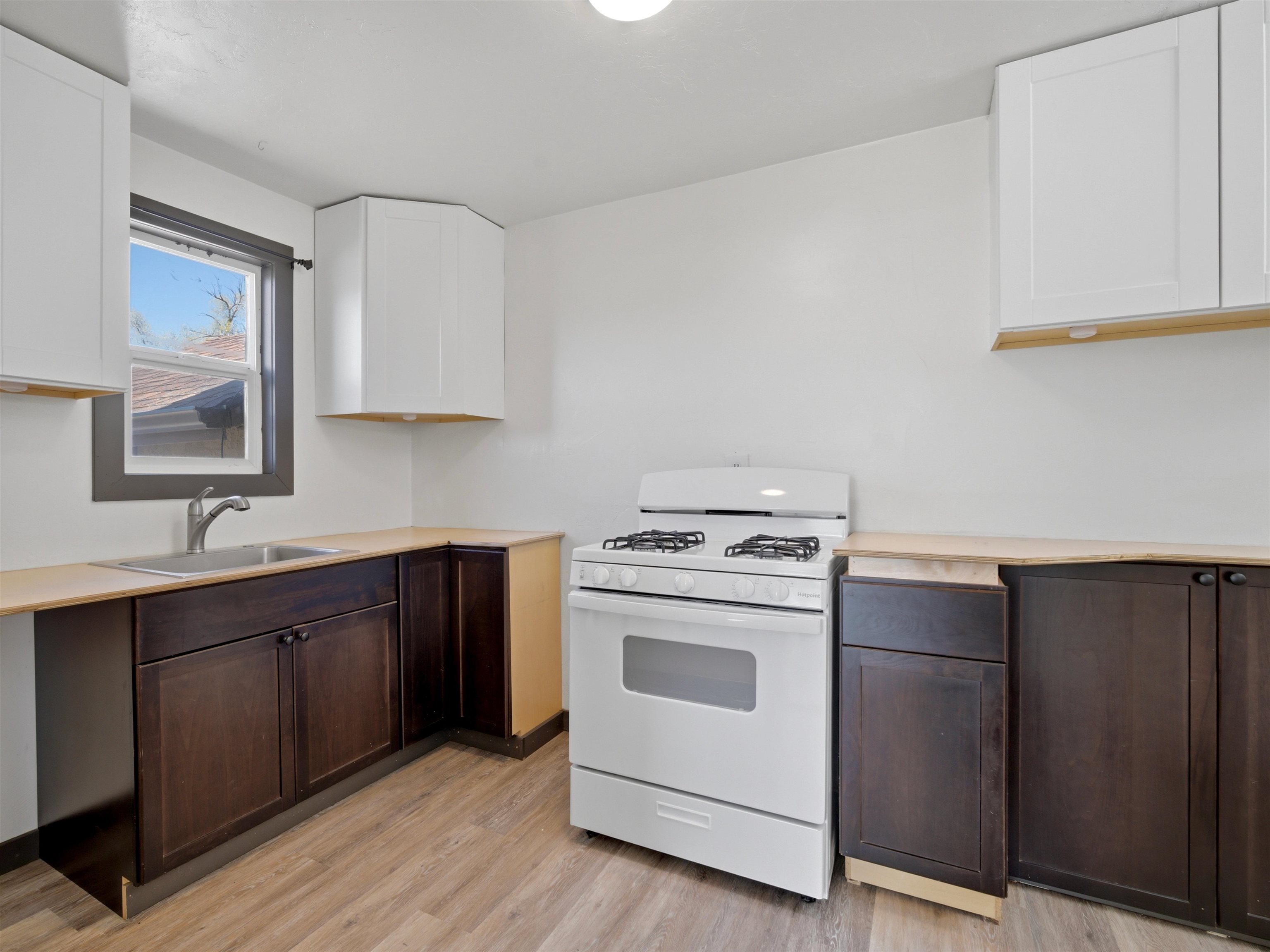 333 Highway 6 And 50 Fruita, CO 81521 - Photo 12 of 36 a kitchen with a stove top oven sink and cabinets