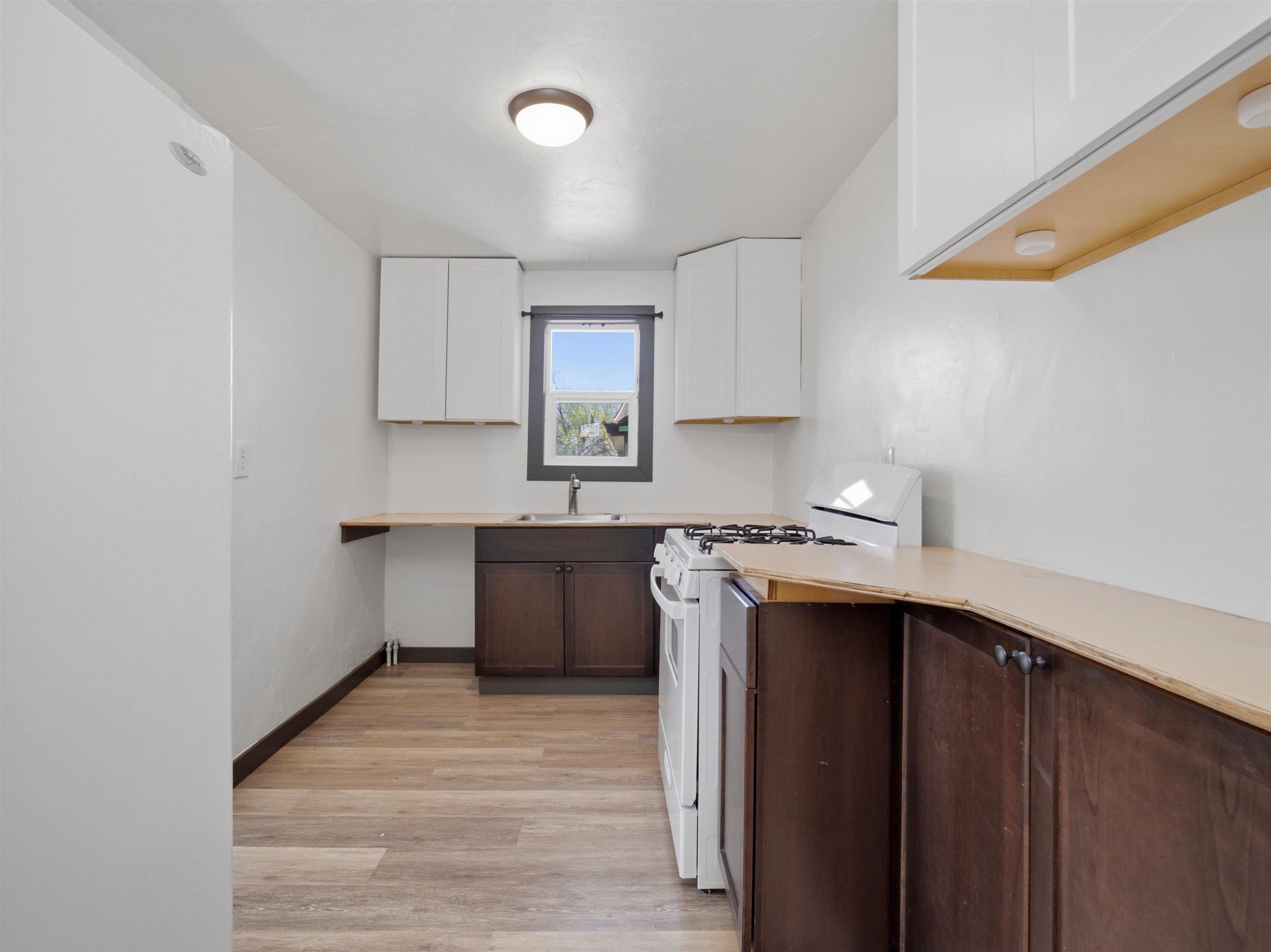 333 Highway 6 And 50 Fruita, CO 81521 - Photo 14 of 36 a kitchen with kitchen island a sink cabinets and wooden floor