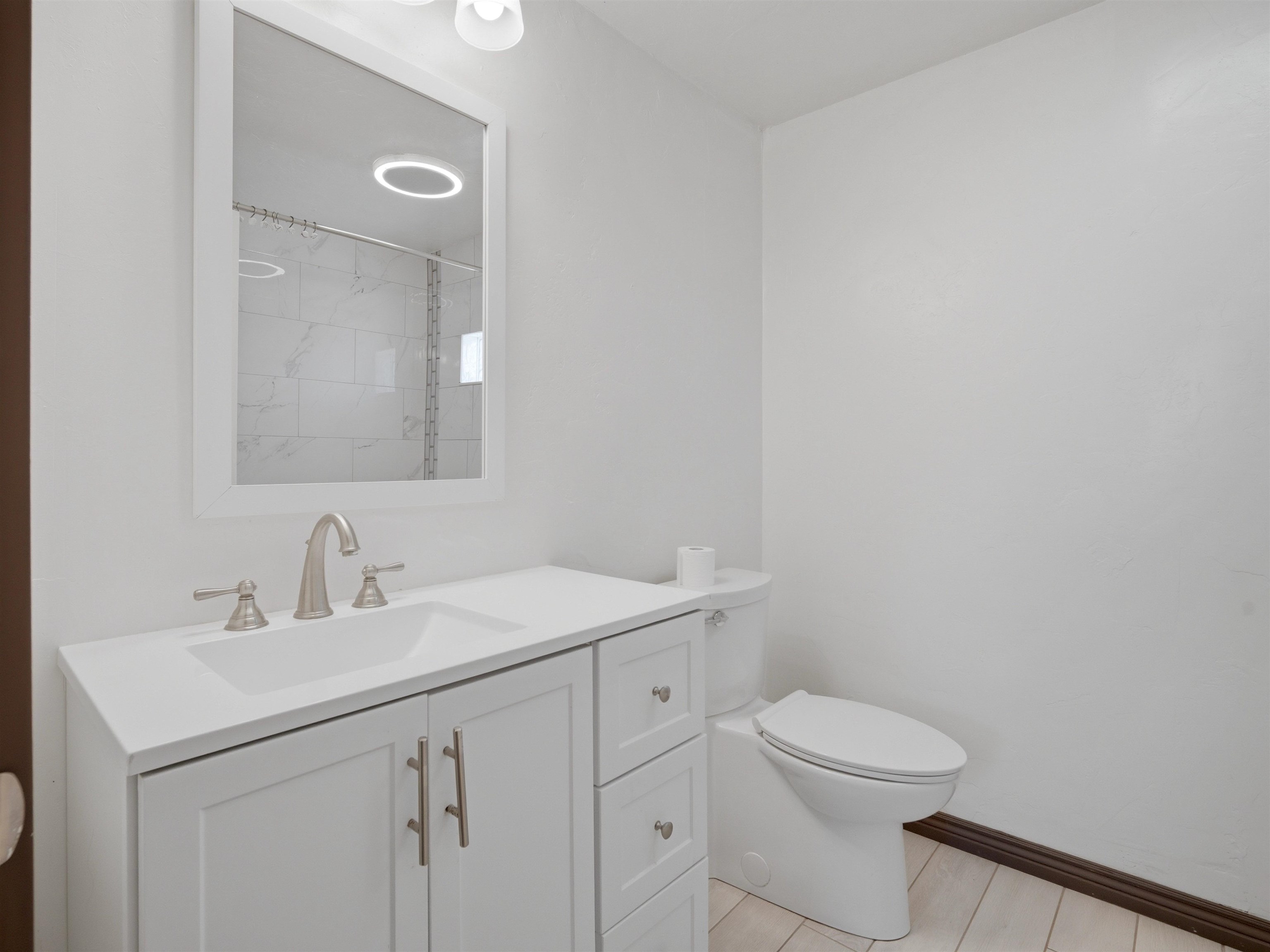 333 Highway 6 And 50 Fruita, CO 81521 - Photo 15 of 36 a bathroom with a toilet a sink and mirror