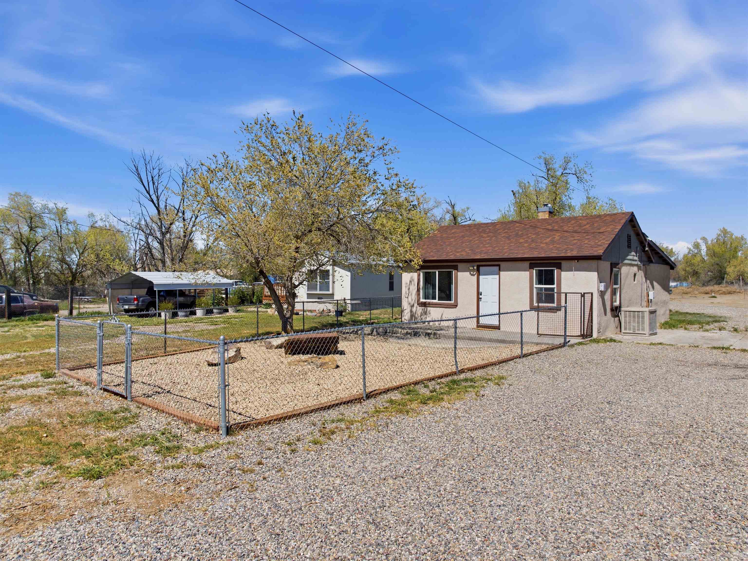 333 Highway 6 And 50 Fruita, CO 81521 - Photo 2 of 36 a front view of a house with a yard