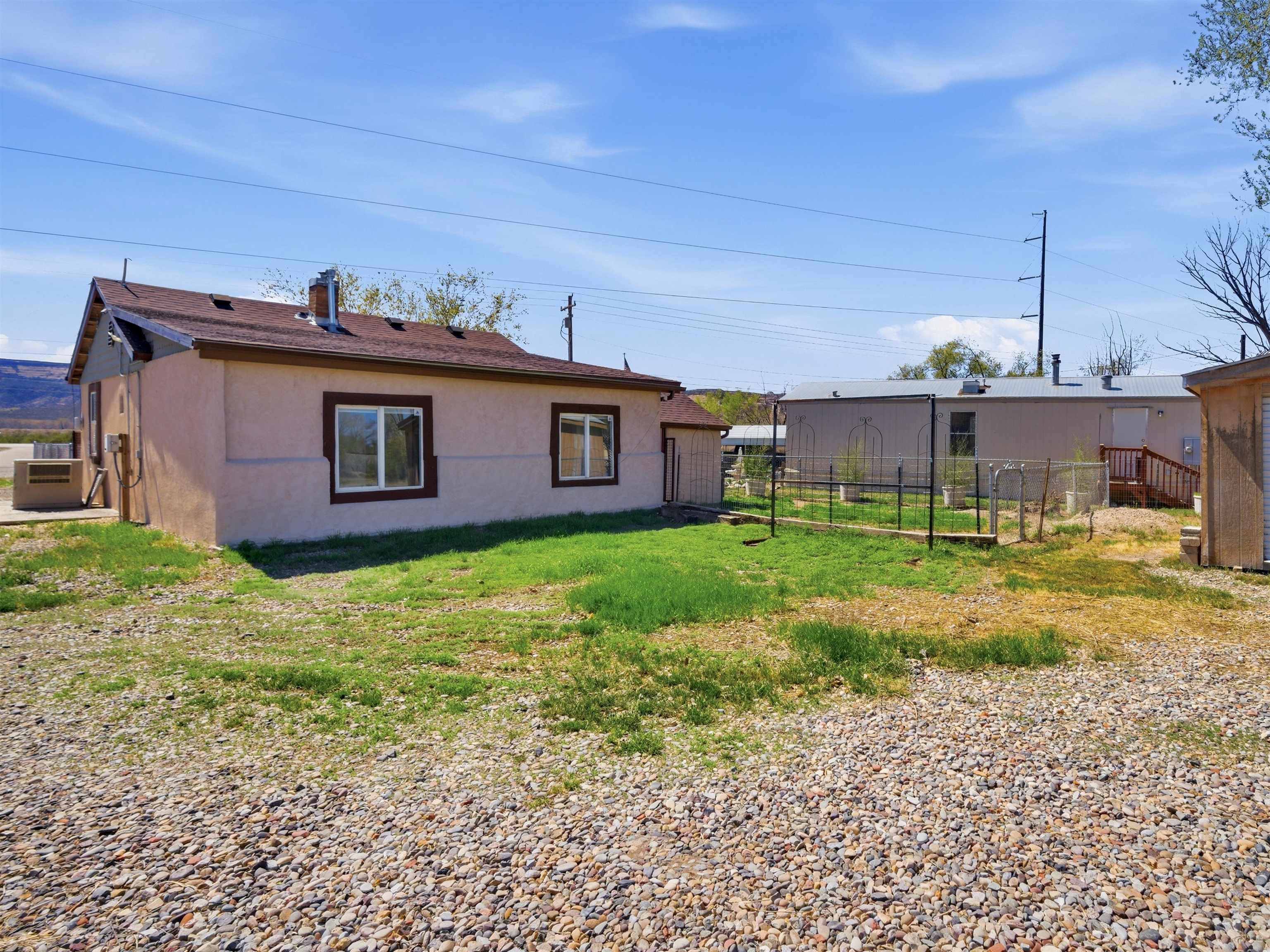 333 Highway 6 And 50 Fruita, CO 81521 - Photo 21 of 36 a view of a house with a backyard