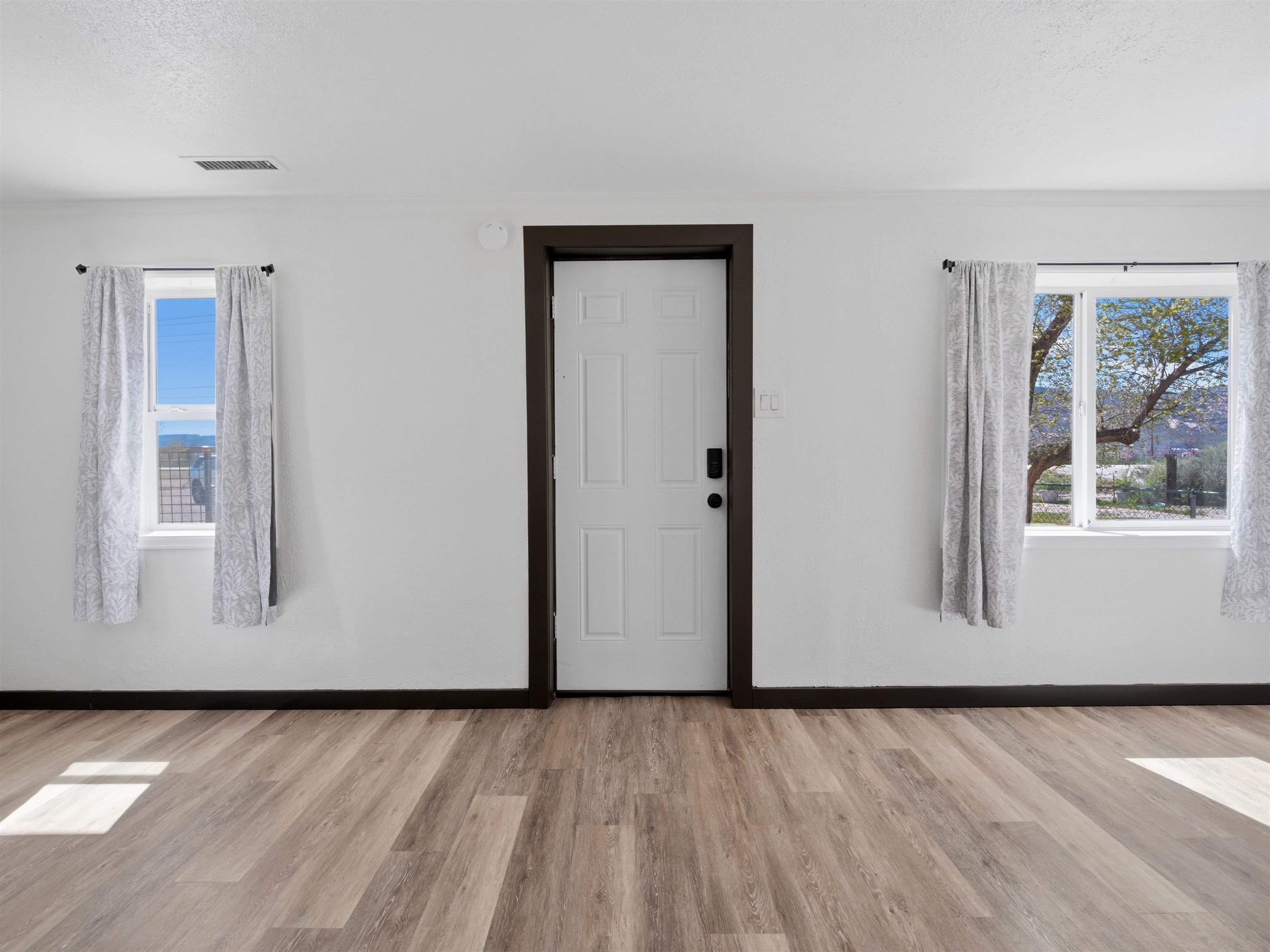 333 Highway 6 And 50 Fruita, CO 81521 - Photo 4 of 36 a view of an empty room with wooden floor and a window