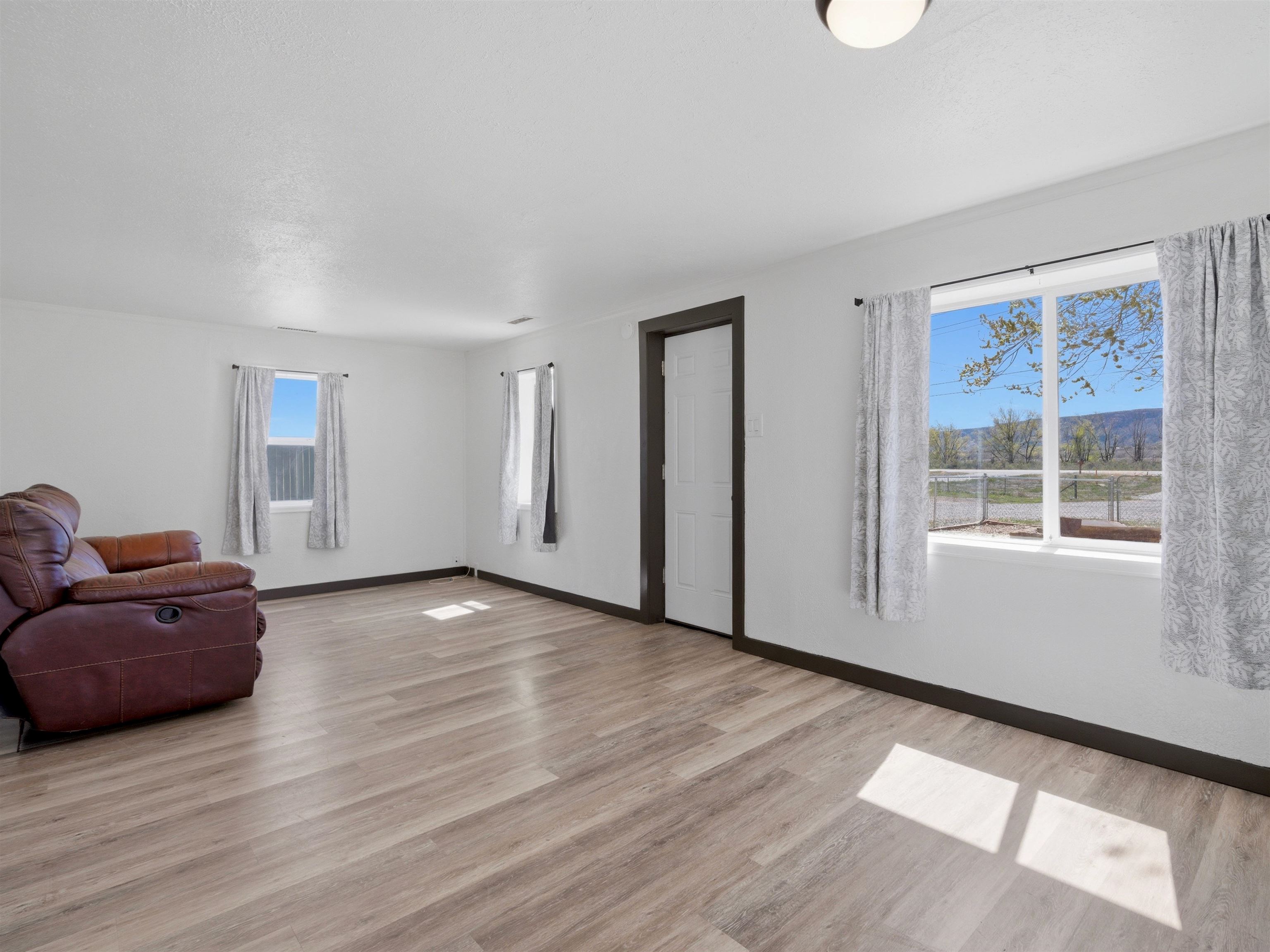 333 Highway 6 And 50 Fruita, CO 81521 - Photo 5 of 36 a view of a livingroom with wooden floor and furniture