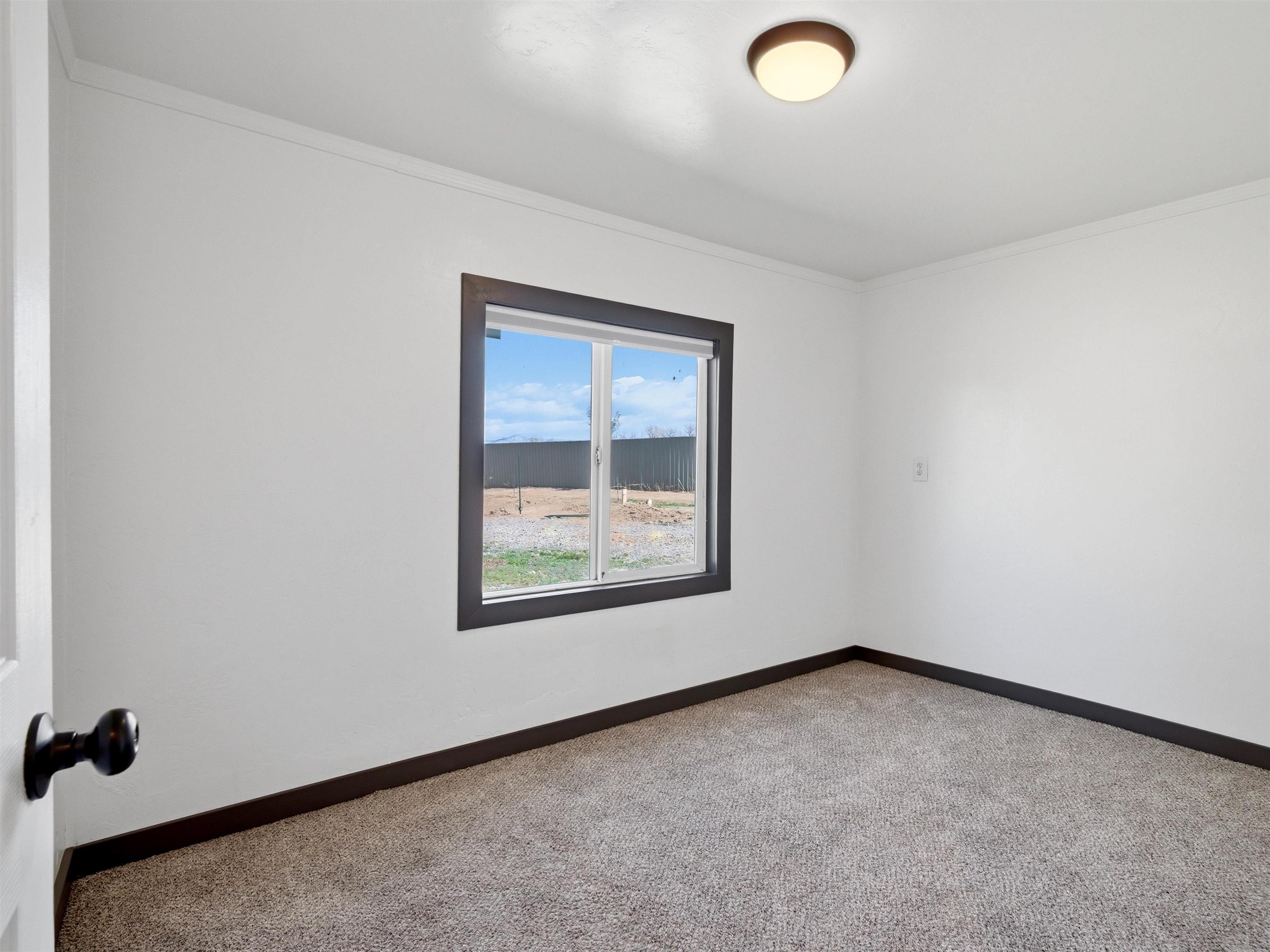 333 Highway 6 And 50 Fruita, CO 81521 - Photo 8 of 36 an empty room with a window