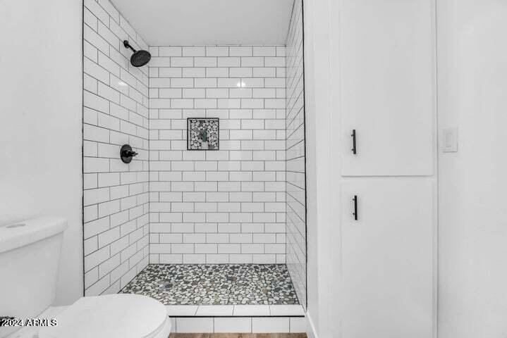 1734 East Laguna Drive Tempe, AZ 85282 - Photo 16 of 23 a bathroom with a toilet and a shower
