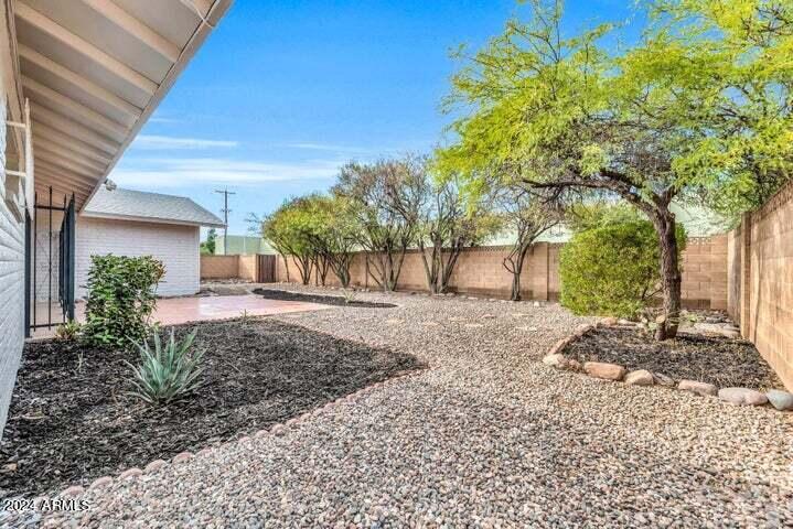 1734 East Laguna Drive Tempe, AZ 85282 - Photo 22 of 23 a view of a backyard with a tree