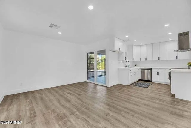 a view of kitchen with wooden floor
