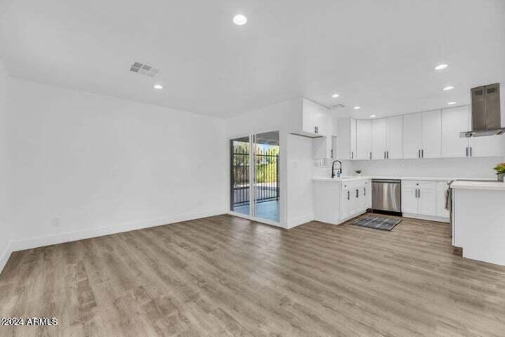 1734 East Laguna Drive Tempe, AZ 85282 - Photo 6 of 23 a view of kitchen with wooden floor
