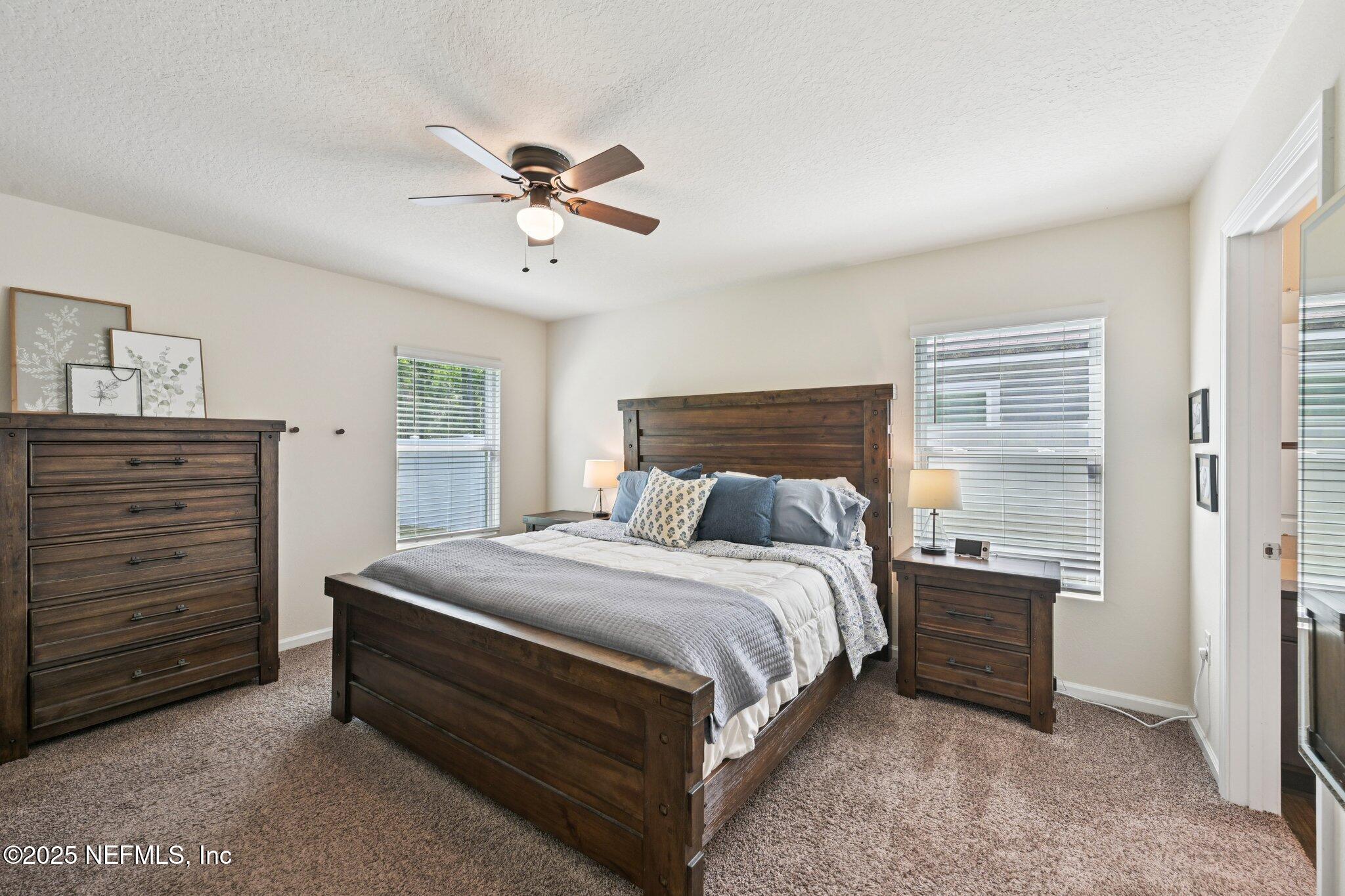 1143 Morgans Treasure Road St. Augustine, FL 32084 - Photo 26 of 39 a bedroom with a bed and a dresser