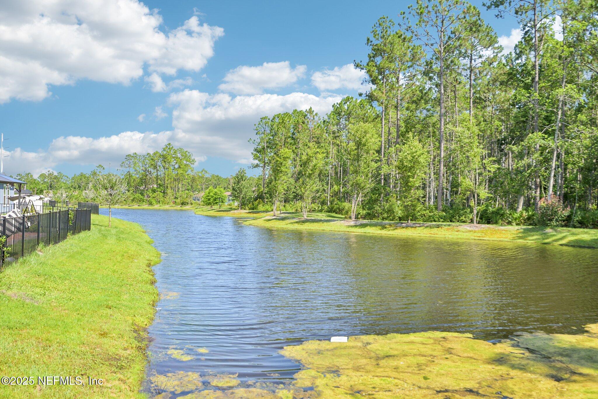1143 Morgans Treasure Road St. Augustine, FL 32084 - Photo 34 of 39 a view of a lake with a yard